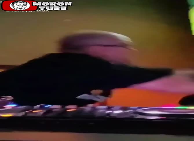 Video :A young man who is interested in a deejay's equipment gets attacked by him